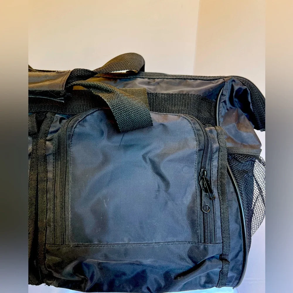 Stylish Vintage Dark Black Duffel Bag with Many Pockets.   New without Tags.